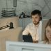 Dedicated call center agents working diligently at their desks in an office.
