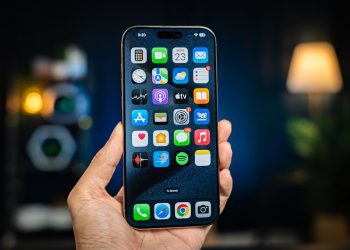 A person holding a cell phone in their hand