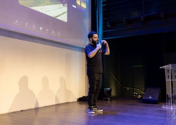 Energetic speaker delivering a talk at a corporate event
