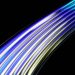 Vibrant curved light trails in blue and yellow on a dark background, depicting speed and technology.