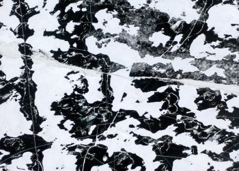 Abstract aerial view of cracked patterns on a frozen lake in Minnesota.