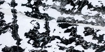 Abstract aerial view of cracked patterns on a frozen lake in Minnesota.