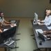 Diverse call center team collaborating in a modern office setting.