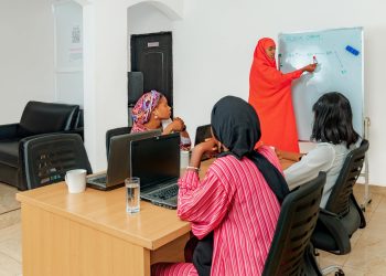 Group of women attending a technology class with a focus on blockchain.