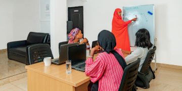Group of women attending a technology class with a focus on blockchain.