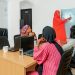 Group of women attending a technology class with a focus on blockchain.