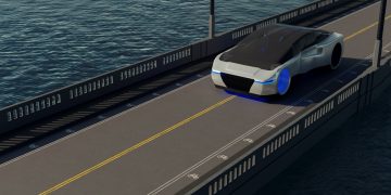 A futuristic car driving on a bridge over a body of water