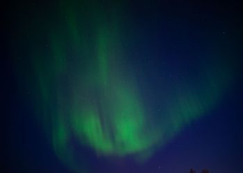 Stunning Aurora Borealis illuminating the night sky in Karasjok, Norway.