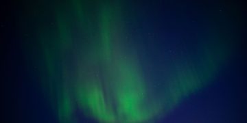 Stunning Aurora Borealis illuminating the night sky in Karasjok, Norway.