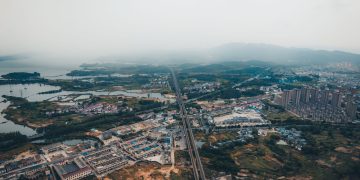 Stunning aerial view of Jiujiang cityscape with sprawling urban and natural landscapes in Jiangxi, China.