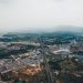 Stunning aerial view of Jiujiang cityscape with sprawling urban and natural landscapes in Jiangxi, China.