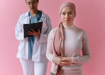 A hopeful cancer patient with a doctor in support during treatment process.