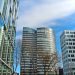 A striking view of modern skyscrapers against a clear blue sky, showcasing contemporary architectural design.