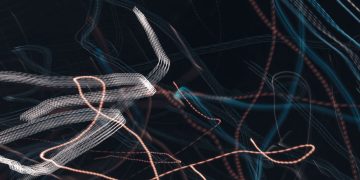 Abstract image showcasing dynamic light trails with motion lines on a dark background.