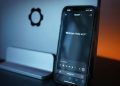 Close-up of a smartphone with AI chat interface, showcasing advanced technology in a sleek design.