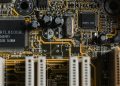 Detailed view of a motherboard with visible microchips and circuits.