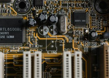 Detailed view of a motherboard with visible microchips and circuits.