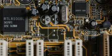 Detailed view of a motherboard with visible microchips and circuits.