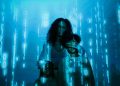 A family stands in digital blue light, symbolizing online privacy and security.