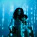 A family stands in digital blue light, symbolizing online privacy and security.