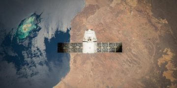 Satellite in orbit with detailed view of Earth and ocean below.