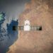 Satellite in orbit with detailed view of Earth and ocean below.