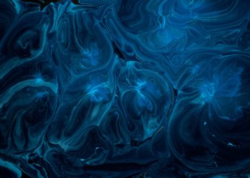 a blue and black background with swirls and bubbles