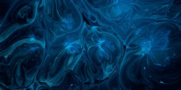 a blue and black background with swirls and bubbles