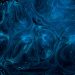 a blue and black background with swirls and bubbles
