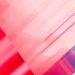 Vibrant abstract geometric pattern with pink and blue gradients creating a modern artistic background.