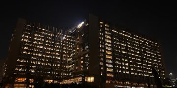 Modern office building illuminated at night
