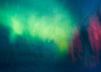 Vibrant abstract artwork depicting a luminous northern lights sky in vivid colors.