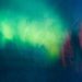 Vibrant abstract artwork depicting a luminous northern lights sky in vivid colors.