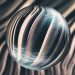 Abstract image of a glass sphere with striped and distorted reflections creating a mesmerizing visual effect.