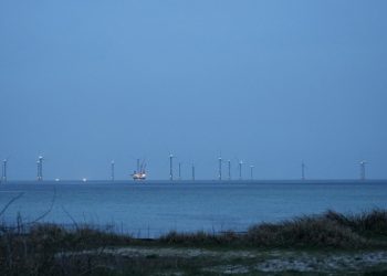 Wind turbines in the distance over the ocean
