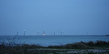 Wind turbines in the distance over the ocean