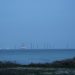Wind turbines in the distance over the ocean