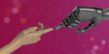 two hands touching each other in front of a pink background