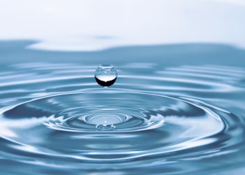A mesmerizing shot of a water droplet capturing the beauty of liquid dynamics.
