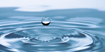 A mesmerizing shot of a water droplet capturing the beauty of liquid dynamics.