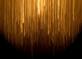 a very long line of yellow lines on a black background