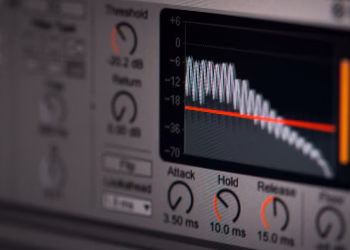 Close-up of audio editing software interface featuring waveform and controls.