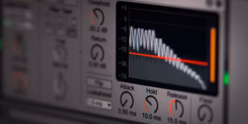 Close-up of audio editing software interface featuring waveform and controls.