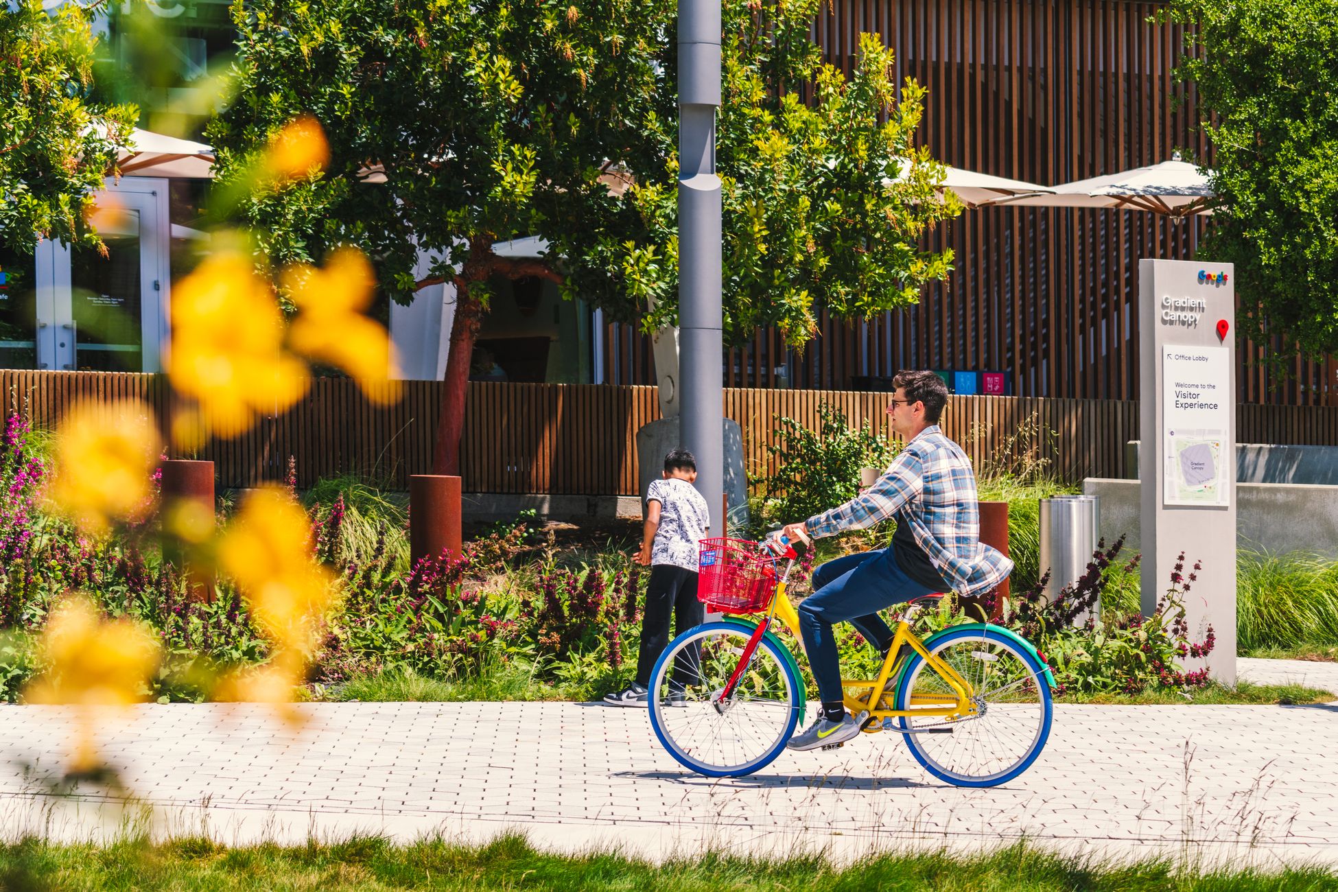 A vibrant day at Googleplex in Mountain View with activities and blooming flowers.