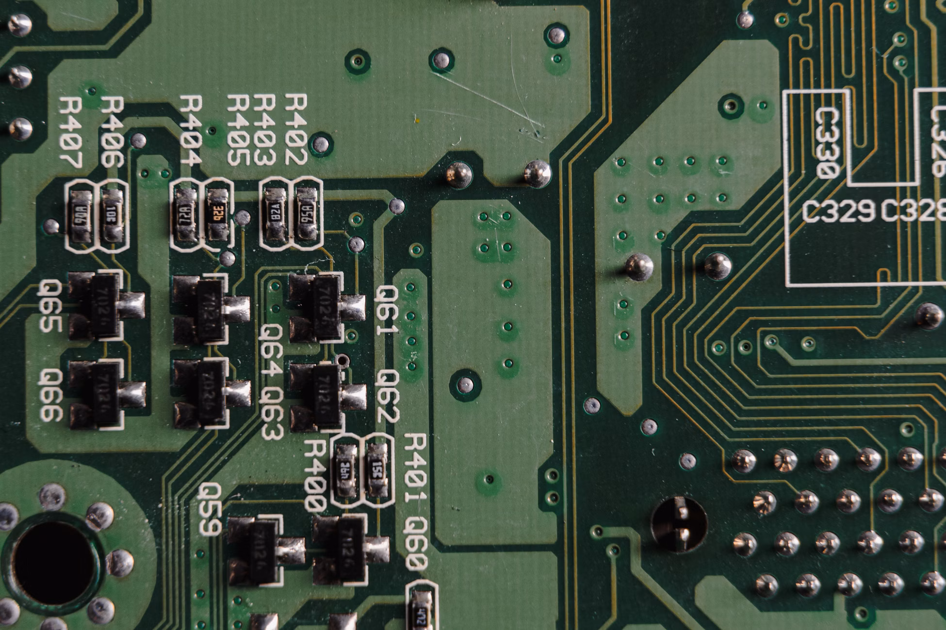 Detailed close-up view of an electronic circuit board with visible components and traces.
