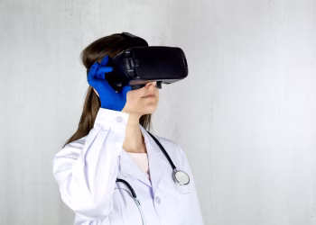 Doctor in a lab coat exploring virtual reality technology with goggles.