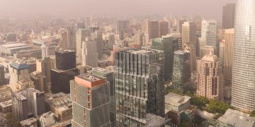 Stunning aerial view of San Francisco's modern skyline showcasing prominent skyscrapers on a foggy day.