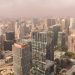 Stunning aerial view of San Francisco's modern skyline showcasing prominent skyscrapers on a foggy day.