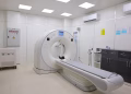 Bright and sterile hospital imaging room featuring a state-of-the-art CT scanner.