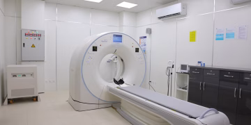Bright and sterile hospital imaging room featuring a state-of-the-art CT scanner.